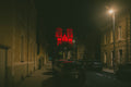 The twin towers of the Basilique Saint-Donatien in Nantes lit deep red against a black night sky