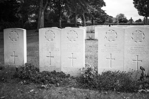 Five headstones of a 22nd Dragoons tank crew standing together, all dated 8 August 1944, Ranville War Cemetery, Normandy